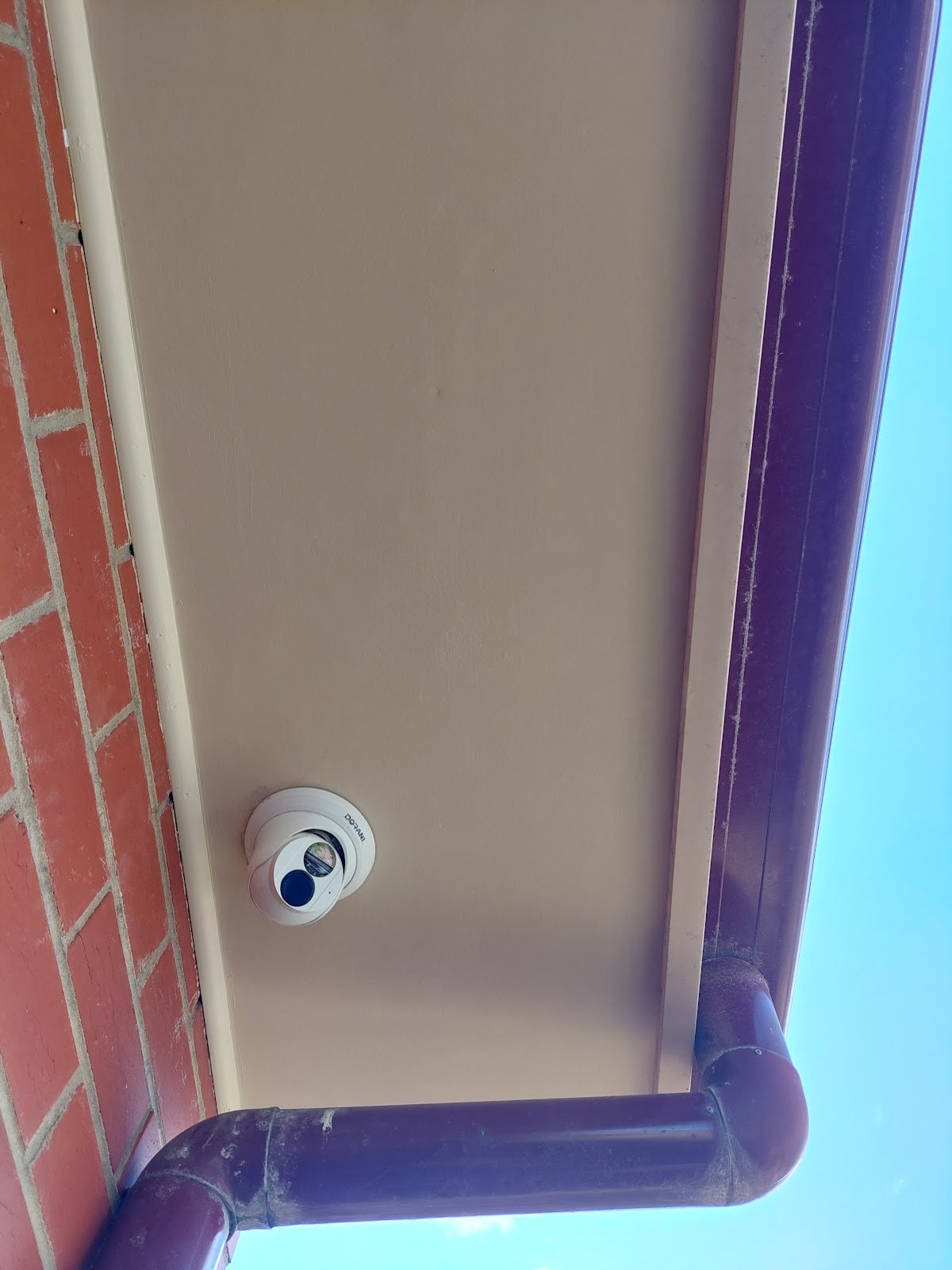 The same eave repaired and repainted so the damage cannot be seen